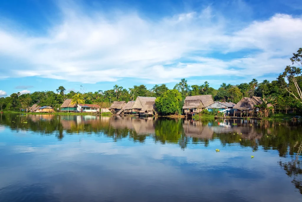 Town on the shore of the Yanayacu River in the Amazon rain forest near Iquitos, Peru