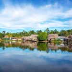 Town on the shore of the Yanayacu River in the Amazon rain forest near Iquitos, Peru
