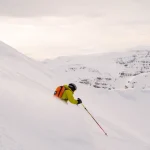 skier carving snowy mountain slope scaled
